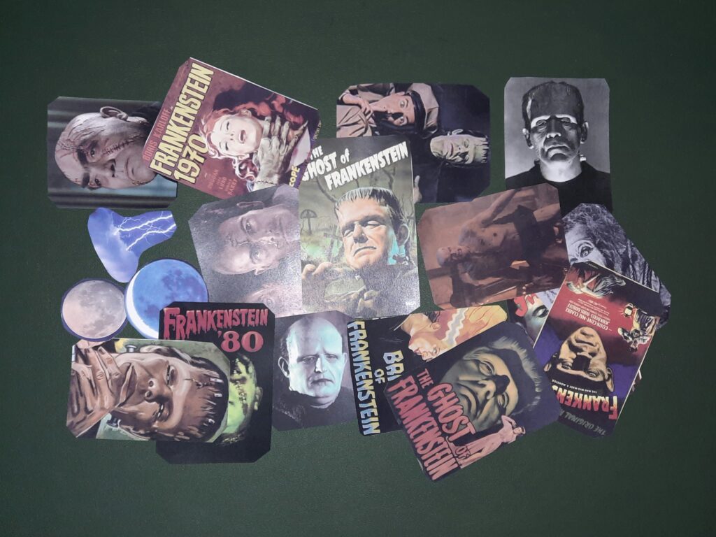 A pile of medium-sized cutout prints with Frankenstein’s creature from various films, a small cut-out of a lightning cloud, and two small cutouts of the moon.