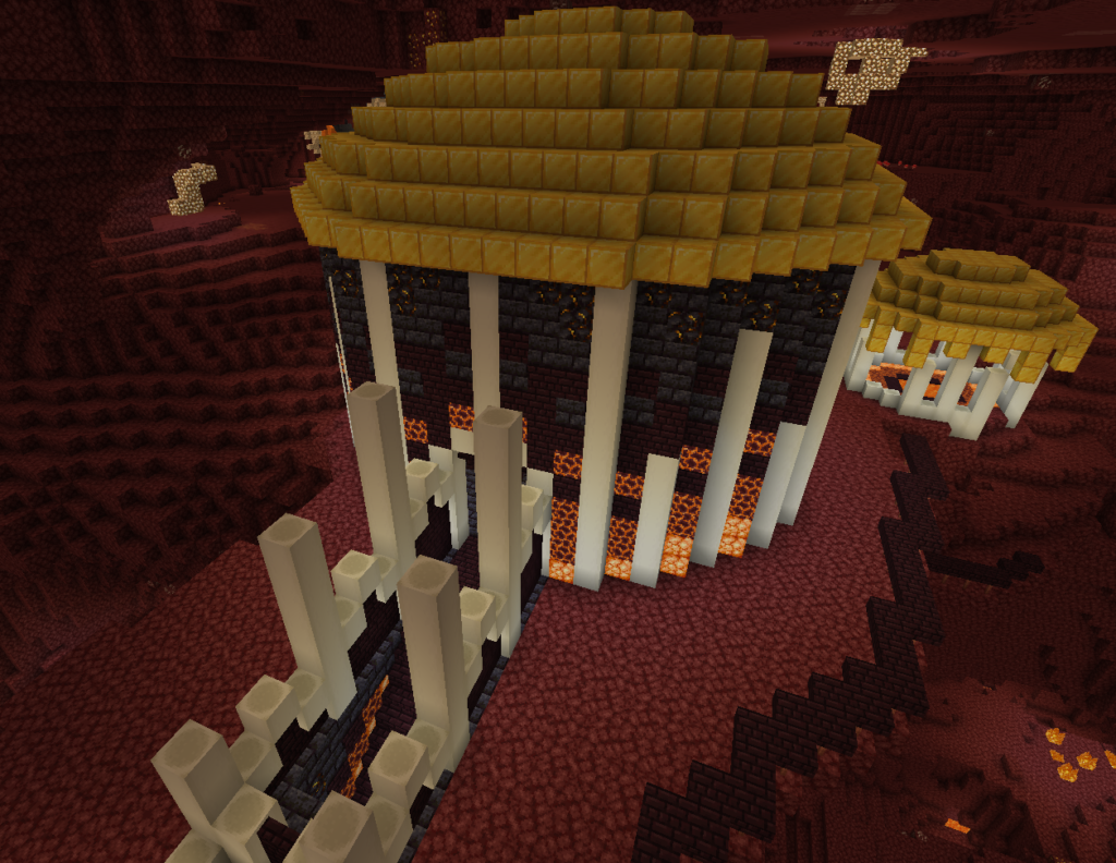 A picture of the castle atop the volcano. Bone pillars line the stairs that lead to the entrance of it. The walls have a gradient from orange at the bottom to black to gold at the roof. In the background to the right is a gold-roofed building behind the main one.